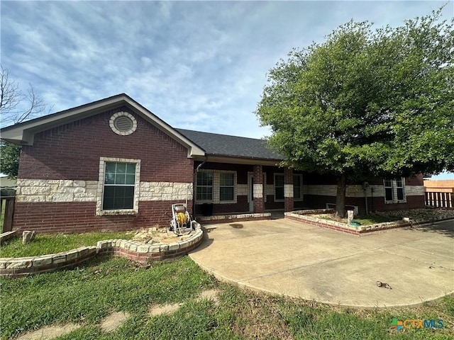 449 Rosehall Ln, Temple, TX 76504 - view of front facade featuring brick siding and a patio