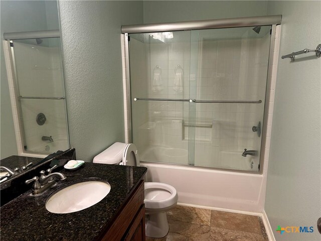 449 Rosehall Ln, Temple, TX 76504 - bathroom featuring vanity, enclosed tub / shower combo, and a textured wall