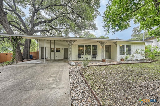 ranch-style home with a carport