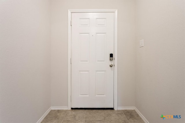 doorway featuring light tile patterned floors