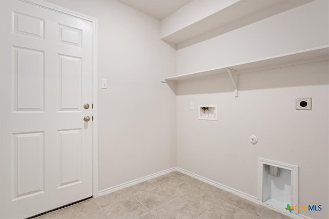 laundry area featuring hookup for a washing machine, electric dryer hookup, light tile patterned floors, and gas dryer hookup