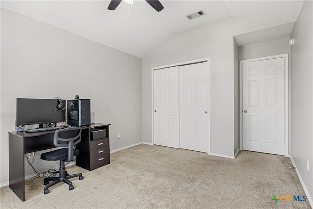 office space featuring ceiling fan, light colored carpet, and vaulted ceiling