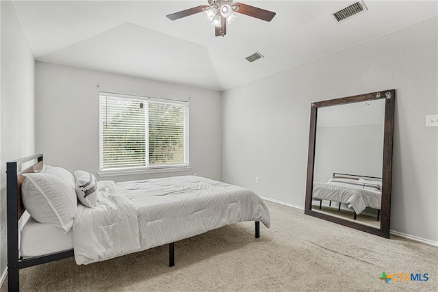 bedroom with lofted ceiling, carpet flooring, and ceiling fan