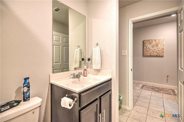 4001 Arafel Ln, Killeen, TX 76542 - bathroom with tile patterned floors, toilet, visible vents, baseboards, and vanity