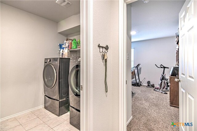 4001 Arafel Ln, Killeen, TX 76542 - laundry room with visible vents, baseboards, independent washer and dryer, tile patterned flooring, and laundry area