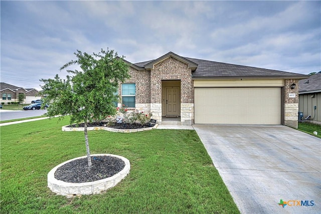4001 Arafel Ln, Killeen, TX 76542 - view of front facade featuring concrete driveway, a front lawn, stone siding, an attached garage, and brick siding
