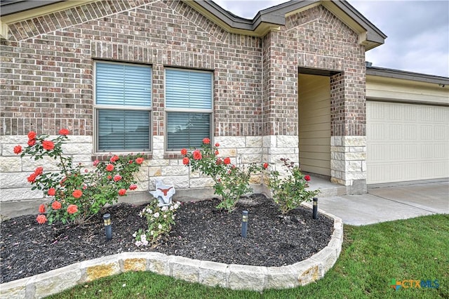 4001 Arafel Ln, Killeen, TX 76542 - view of front facade featuring stone siding, an attached garage, and brick siding