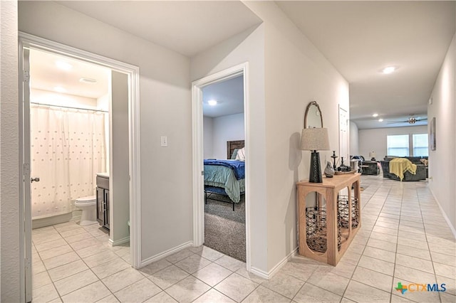 4001 Arafel Ln, Killeen, TX 76542 - hall featuring baseboards, light tile patterned flooring, and recessed lighting