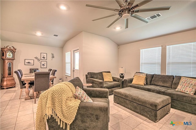 4001 Arafel Ln, Killeen, TX 76542 - living area with a ceiling fan, vaulted ceiling, light tile patterned flooring, and visible vents