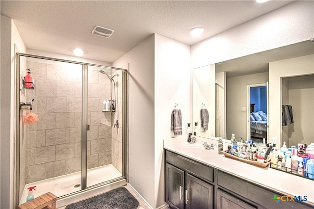 4001 Arafel Ln, Killeen, TX 76542 - ensuite bathroom with visible vents, vanity, a stall shower, and connected bathroom