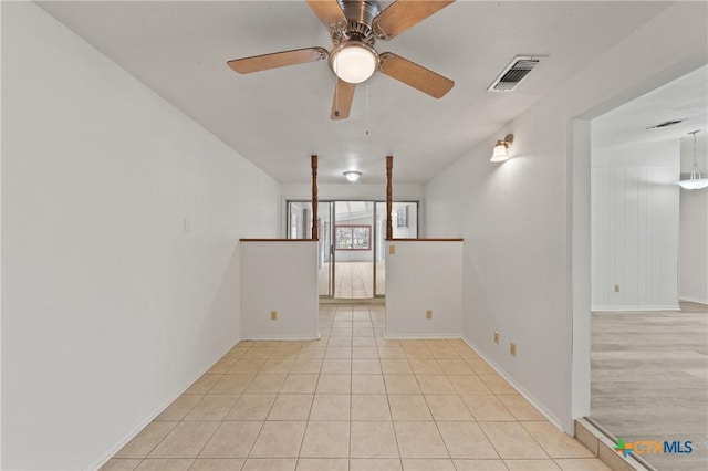 unfurnished room featuring light tile patterned floors and ceiling fan