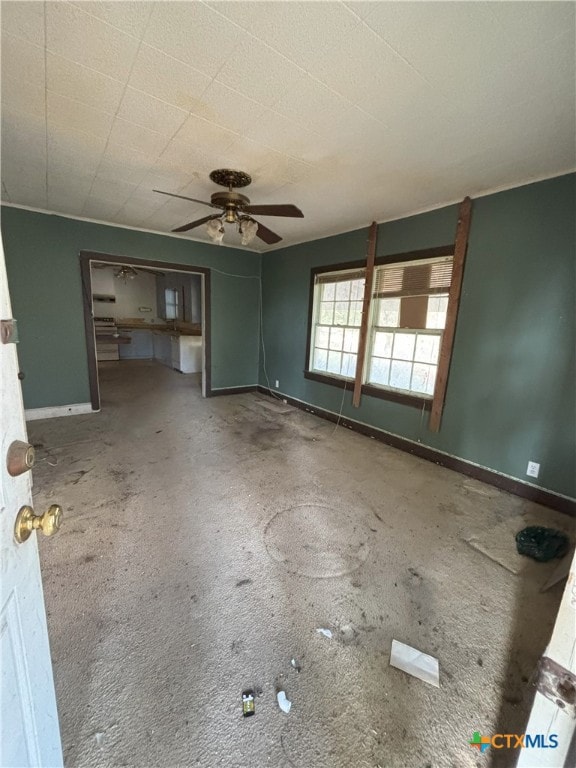 unfurnished room with ceiling fan