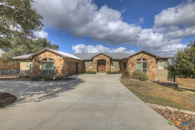 ranch-style house featuring a garage