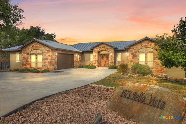 ranch-style house featuring a garage