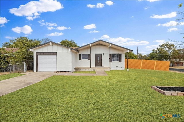 ranch-style home with a front lawn and a garage