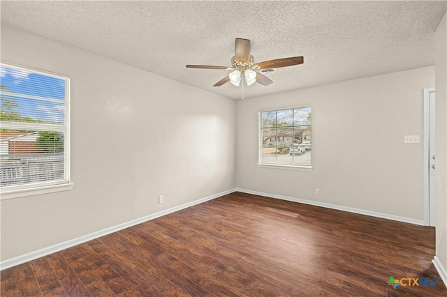 spare room featuring a textured ceiling, dark hardwood / wood-style floors, and ceiling fan