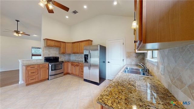 1802 Spring Valley Dr, Dripping Springs, TX 78620 - kitchen with stainless steel appliances, ceiling fan, a peninsula, high vaulted ceiling, and tasteful backsplash