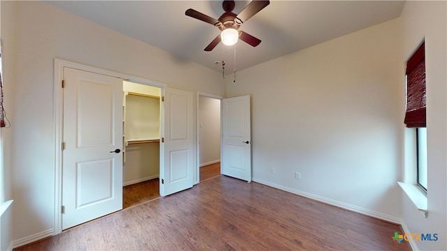 1802 Spring Valley Dr, Dripping Springs, TX 78620 - unfurnished bedroom with wood finished floors, a closet, and a ceiling fan