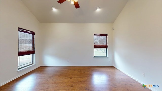 1802 Spring Valley Dr, Dripping Springs, TX 78620 - empty room with plenty of natural light, a ceiling fan, lofted ceiling, and wood finished floors