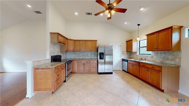 1802 Spring Valley Dr, Dripping Springs, TX 78620 - kitchen with stainless steel appliances, ceiling fan, light stone counters, tasteful backsplash, and high vaulted ceiling