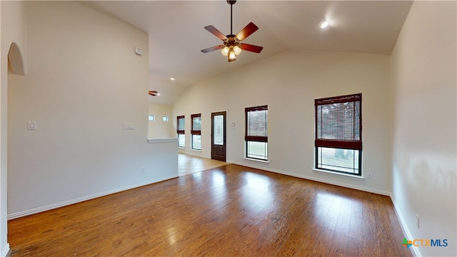 1802 Spring Valley Dr, Dripping Springs, TX 78620 - unfurnished room with lofted ceiling, ceiling fan, wood finished floors, and arched walkways