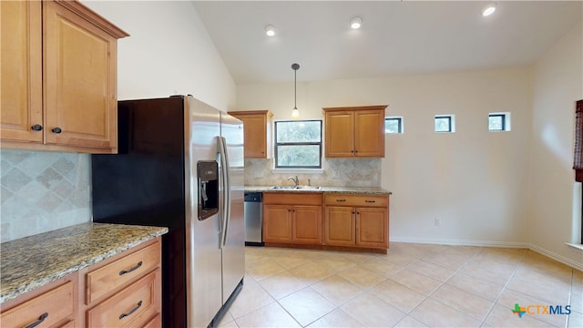 1802 Spring Valley Dr, Dripping Springs, TX 78620 - kitchen with stainless steel appliances, light stone counters, decorative backsplash, light tile patterned floors, and recessed lighting