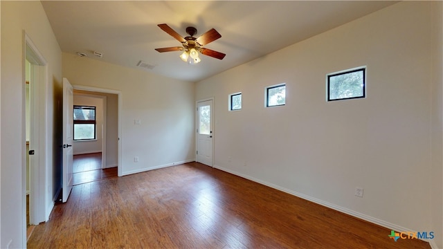 1802 Spring Valley Dr, Dripping Springs, TX 78620 - unfurnished room featuring plenty of natural light, wood finished floors, and a ceiling fan