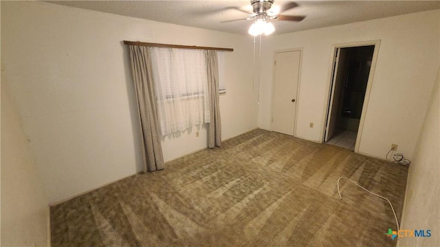 unfurnished bedroom with light carpet, ensuite bath, and ceiling fan