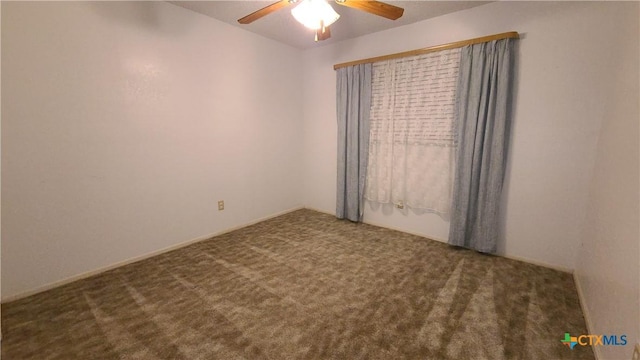 empty room with carpet flooring and ceiling fan