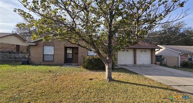 ranch-style home with a front yard and a garage