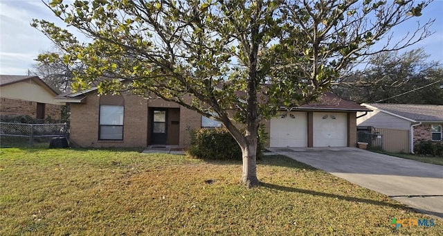 ranch-style house with a front yard and a garage