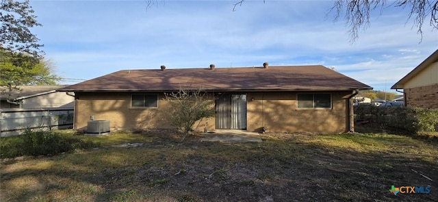 rear view of house with cooling unit