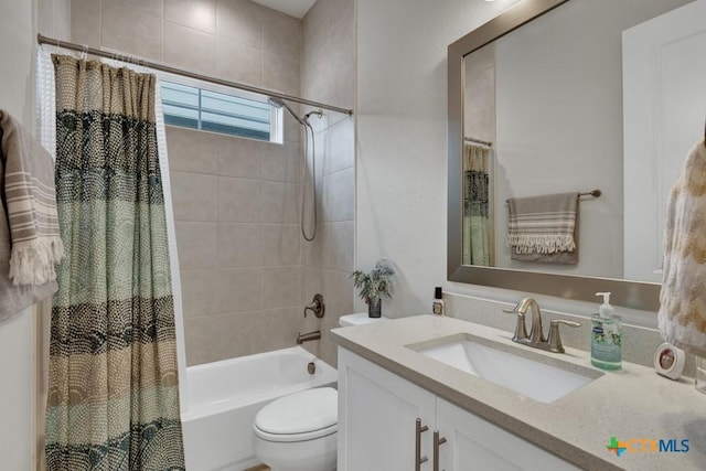 full bathroom with vanity, toilet, and shower / bathtub combination with curtain