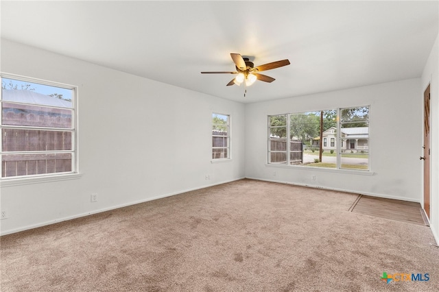 571 N Houston Ave, New Braunfels, TX 78130 - carpeted spare room with a ceiling fan and baseboards
