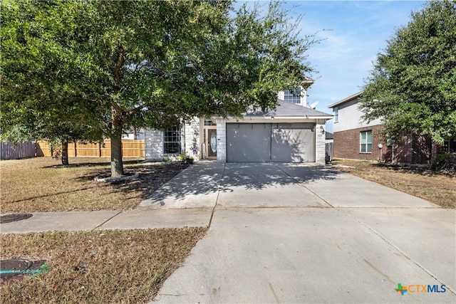 obstructed view of property with a front lawn