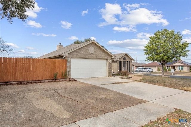 ranch-style home featuring a garage