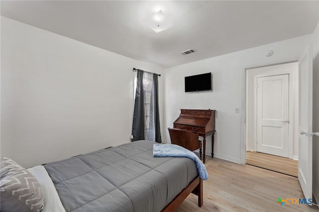 bedroom with light hardwood / wood-style flooring