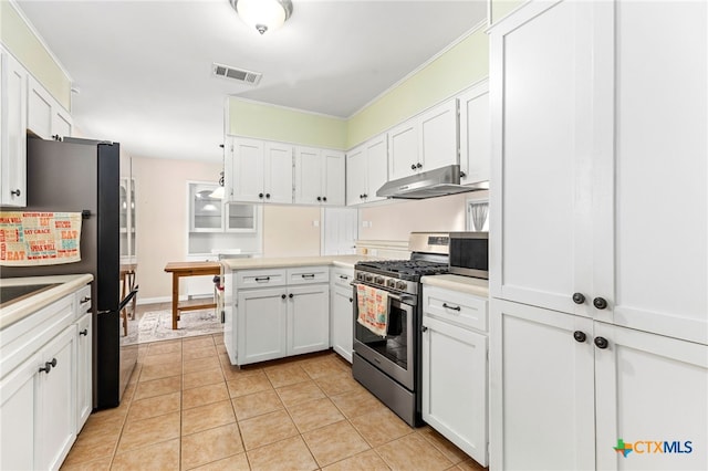 kitchen featuring stainless steel appliances, visible vents, light tile patterned flooring, white cabinetry, and under cabinet range hood