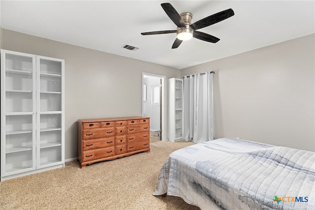 bedroom featuring a ceiling fan, carpet, visible vents, and baseboards