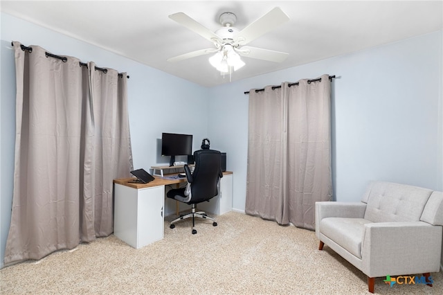 office space with carpet floors and a ceiling fan