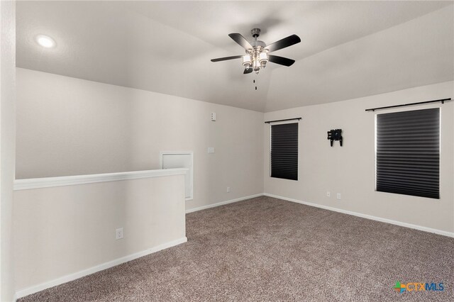 empty room featuring carpet, ceiling fan, and lofted ceiling