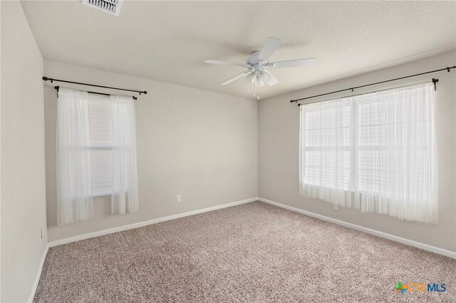 unfurnished room featuring carpet flooring and ceiling fan