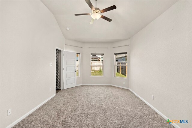 unfurnished room featuring carpet flooring, ceiling fan, and lofted ceiling