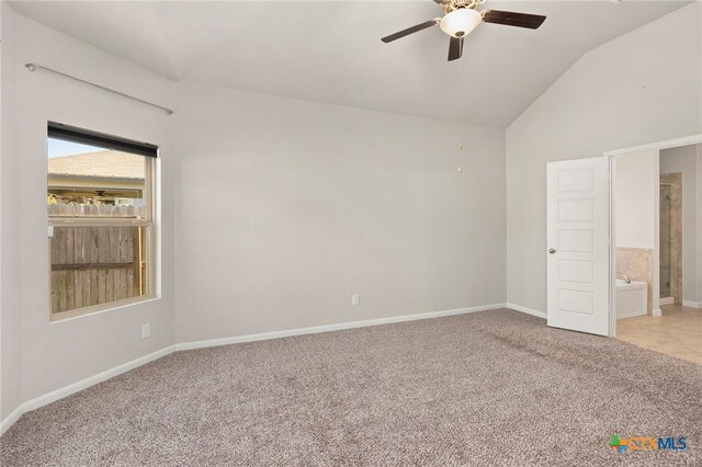 unfurnished bedroom with ensuite bathroom, ceiling fan, light colored carpet, and lofted ceiling