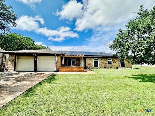 3043 Boys Ranch Rd, Kempner, TX 76539 - single story home with a garage, solar panels, brick siding, and a front lawn