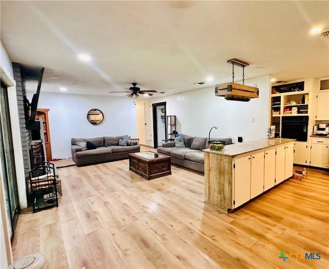 3043 Boys Ranch Rd, Kempner, TX 76539 - living room featuring light wood-style floors, ceiling fan, and recessed lighting
