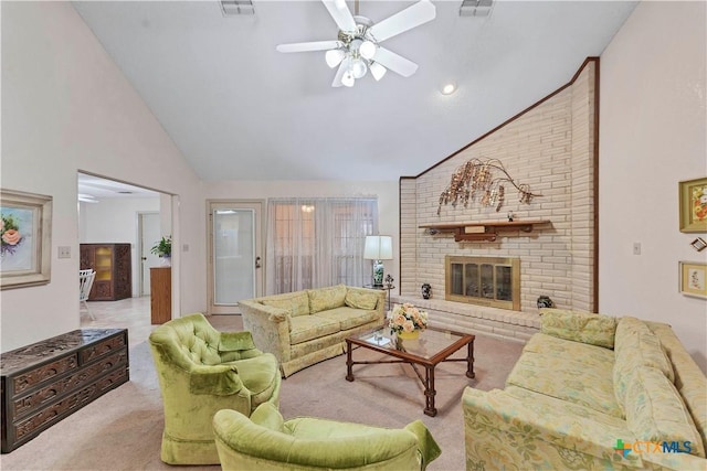 carpeted living room featuring a fireplace, high vaulted ceiling, and ceiling fan