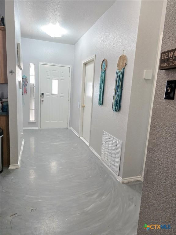 2814 Blackburn Dr, Killeen, TX 76543 - foyer featuring a textured wall and concrete floors