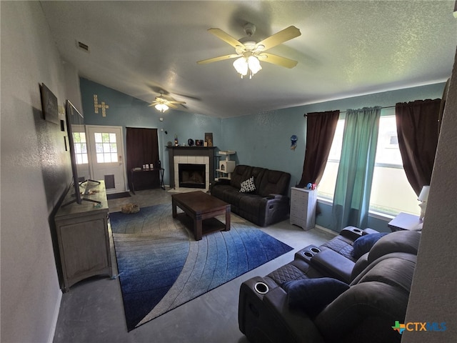 2814 Blackburn Dr, Killeen, TX 76543 - living room with a ceiling fan, a tile fireplace, and lofted ceiling