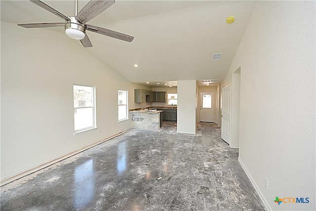 unfurnished living room with lofted ceiling and ceiling fan